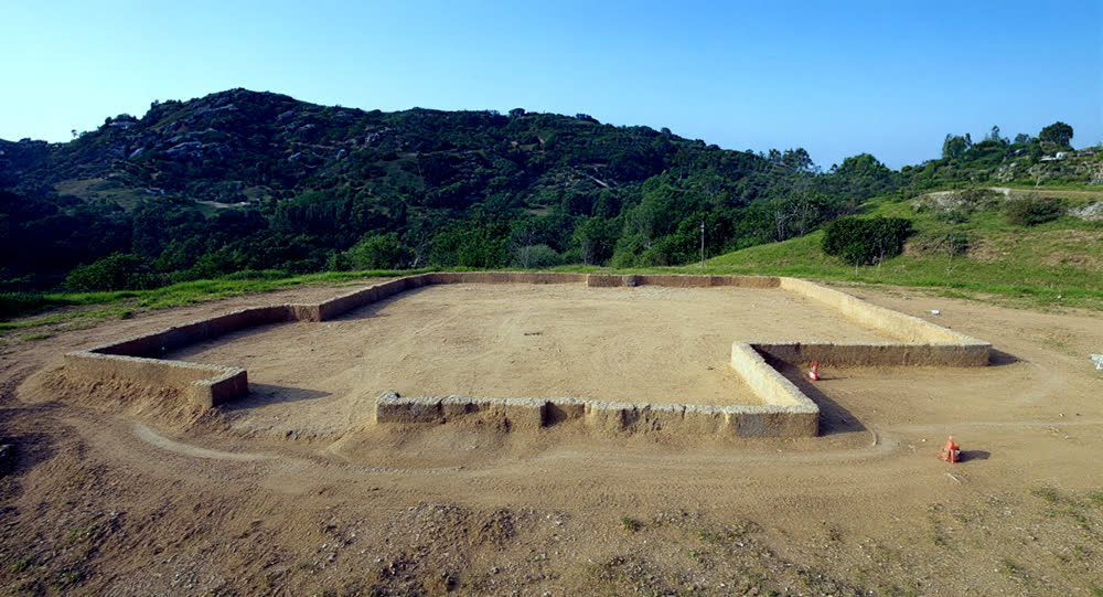 Excavated hillside plot with foundation trenches cut